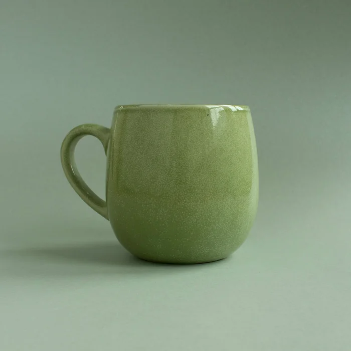 Stor kopp grønn bakgrunn